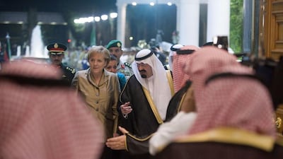 King Abdullah welcomes German Chancellor Angela Merkel on May 25, 2010 at the Royal Palace in Jeddah. Guido Bergmann / Bundesregierung / AFP Photo