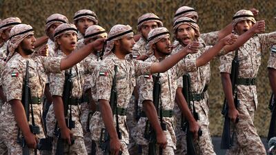 Members of the Armed Forces march during the celebrations at the Abu Dhabi National Exhibition Centre. Christopher Pike / The National