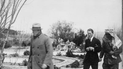 T E Lawrence walks with Emir Abdullah in the garden of Government House in Jerusalem, as Winston Churchill walks ahead, in early 1921. Courtesy: Library of Congress, Prints & Photographs Division