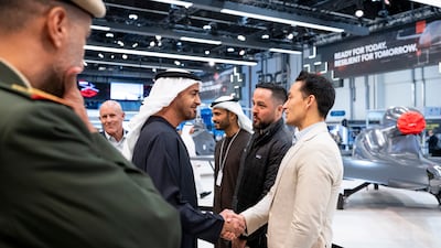 President Sheikh Mohamed greets a participant at the Umex event, at Abu Dhabi National Exhibition Centre. Photo: UAE Presidential Court