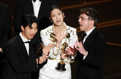 Yu Han Lee, Ejae and Mark Sonnenblick celebrate after winning the Oscar for their Kpop Demon Hunters song Golden. EPA