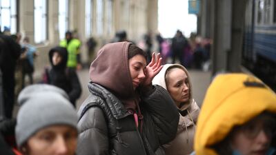 A Ukrainian woman cries as she boards a train in Lviv, western Ukraine, on her way to Poland. AFP