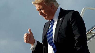 US president Donald Trump gestures as he arrives in Florida for the Good Friday holiday and Easter weekend. Yuri Gripas / Reuters