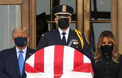 US President Donald Trump and First Lady Melania Trump pay their respects to Justice Ruth Bader Ginsburg as her casket lies in repose at the top of the steps of the US Supreme Court building in Washington on September 24, 2020. Reuters