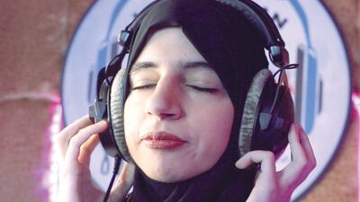 Israa Al Amiri lends her voice to a song created by an Emirati poet for the UAE’s Golden Jubilee celebrations. Photo: Amr Waheed