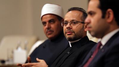 Monsignor Youannis Lahzi Gaid, personal secretary of Pope Francis, second right, speaks to journalists as Prof. Mohamed Hussein El-Mahrassawy, President of Al-Azhar University, left, and Judge Mohamed Mahmoud Abdel Salam, former advisor to the Grand Imam of Al-Azhar, attend a roundtable discussion to mark one year since Pope Francis' historic trip to the Arabian Peninsula, in Abu Dhabi, United Arab Emirates. AP Photo