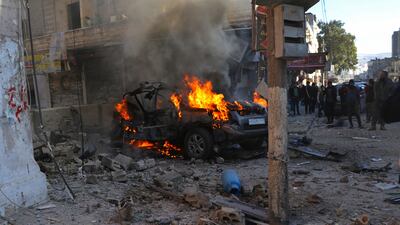 A burning car hit by a rocket attack in the town of Afrin, north of Aleppo in January. The latest incident follows attacks by Turkish drones and warplanes on the Kurdish YPG militia in Syria over the past few days. AP