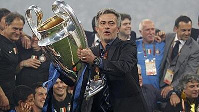 Jose Mourinho holds the European Cup aloft for the second time with his second club. He hopes to be the first coach to lift the trophy with three different clubs.
