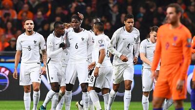 Paul Pogba, centre, scored the only goal of the game as France left Amsterdam with all three points. Franck Fife / AFP