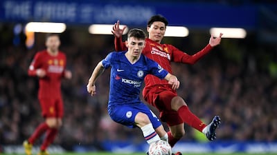 Chelsea midfielder Billy Gilmour shields the ball from Liverpool forward Takumi Minamino during the FA CUp fifth round match at Stamford Bridge. Getty Images
