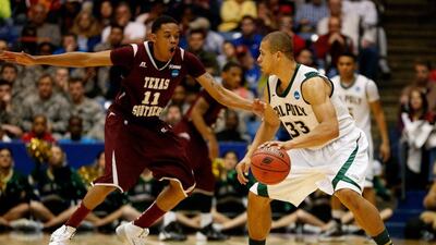 Cal Poly, in white, made it into the NCAA Tournament proper by beating Texas Southern, in red, in a play-in game on March 19, 2014. Gregory Shamus / Getty Images / AFP