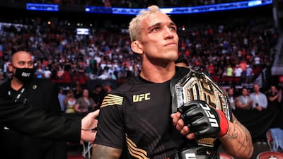 Charles Oliveira celebrates defeating Michael Chandler to win the UFC lightweight title on May 15, 2021 in Houston, Texas. AFP