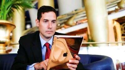 Felipe Florez-Arango with his 24-carat rose gold iPad after winning an auction to raise money for breast cancer awareness.