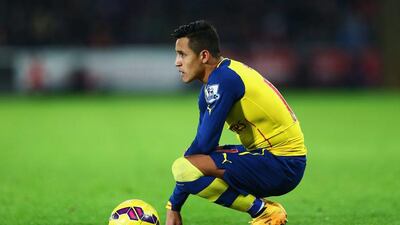 Alexis Sanchez of Arsenal looks on during his side's 2-1 Premier League loss to Swansea City on Sunday. Michael Steele / Getty Images / November 9, 2014