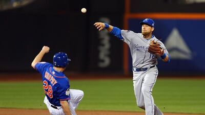 Daniel Murphy #28 of the New York Mets is forced out at second base as Ben Zobrist #18 of the Kansas City Royals turns a double play in the fourth inning during Game Five of the 2015 World Series between the Kansas City Royals and the New York Mets at Citi Field on November 1, 2015 in the Flushing neighborhood of the Queens borough of New York City. Elsa/Getty Images/AFP