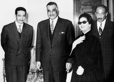 Egyptian President Gamal Abdel Nasser and his successor Anwar Al-Sadat pose with Egyptian singer Umm Kulthum and Egyptian composer Mohamed al-Mogi in Cairo in the late 1960s. AFP