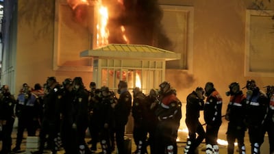 A police line is affected by a molotov cocktail outside a goverment building during a protest in Tirana, Albania, 11 May 2019. EPA/Malton Dibra