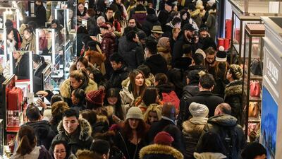 A large crowd of people shop during Black Friday at Macy's flagship store on 34th St in New York City. Reuters
