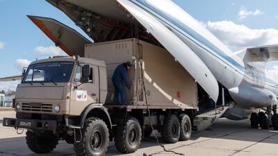 A Russian Ilyushin IL-76 transport aircraft is loaded for its flight to Italy. EPA