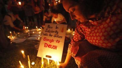 Candles are left at a vigil in Singapore for the 23-year-old Indian gang-rape victim who died on Friday. Her violent death has prompted international outrage.