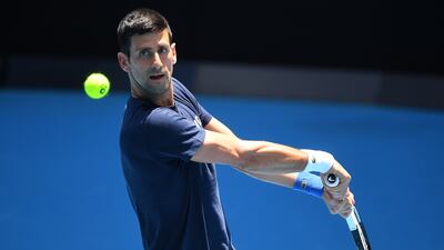 Novak Djokovic hits a return. EPA