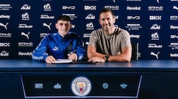 Phil Foden with director of football Hugo Viana after signing his new contract with Manchester City. Photo: Manchester City FC