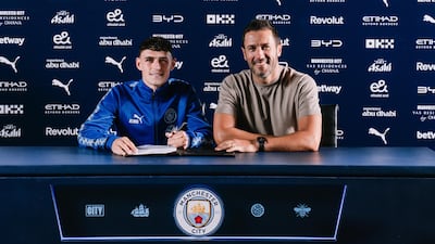 Phil Foden with director of football Hugo Viana after signing his new contract with Manchester City. Photo: Manchester City FC