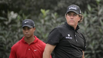 Tiger Woods, left, and Phil Mickelson are huge rivals so the timing of the HSBC comments and Mickelson’s commitment were seen by some as a Woods snub. Andy Wong / AP Photo