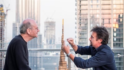 Hammond and Baker discuss the Burj with a cardboard model at the Taj Hotel.