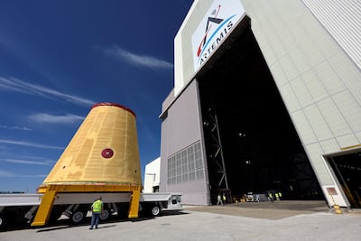 Workers move equipment for Nasa's Artemis II programme, which aims to establish a permanent crewed base on the Moon by the end of the decade. Reuters
