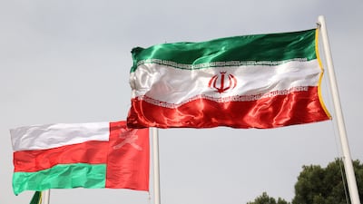 The flags of Iran and Oman. Reuters