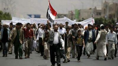 Yemenis who live in a neighbourhood near the site of anti-government demonstrations hold a counter-demonstration demanding that the protestors leave the area in Sanaa yesterday.