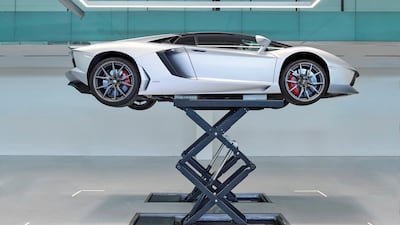 A Lamborghini Aventador is examined at a workshop in Dubai. Cloud 9 Photography