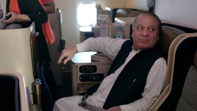 Ousted Pakistani Prime Minister Nawaz Sharif sits on a plane after landing at the Allama Iqbal International Airport in Lahore. Reuters