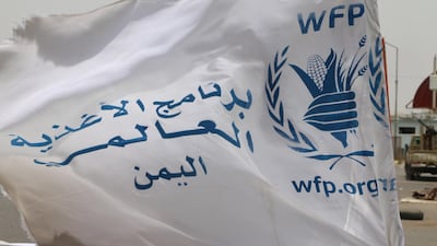 A flag of the World Food Program (WFP) waves on a vehicle carrying a team of the WFP at the key grain storage silos in the war-torn city of Hodeidah, Yemen, 23 July 2019. EPA