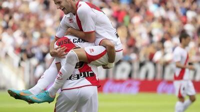 Rayo Vallecano's midfielder Jose Carlos Fernandez, left, celebrates with his teammate Leo Baptistao after scoring in a win over Deportivo La Coruna. Rayo has won four in a row.