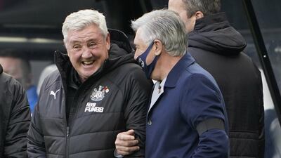 Newcastle manager Steve Bruce, left, and his Everton counterpart Carlo Ancelotti share a joke before the match. EPA