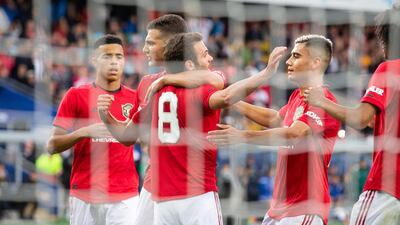 United players celebrate Juan Mata's goal. Reuters