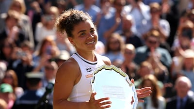 Runner-up Jasmine Paolini of Italy smiles with her trophy. Getty Images
