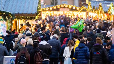 People visit the newly opened 'Christkindlmarkt', Vienna's classic Christmas market, on the square in front of the City Hall in Vienna. AFP