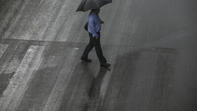The showers experienced on Sunday across the country also led to a rush on umbrellas. Mona Al Marzooqi / The National