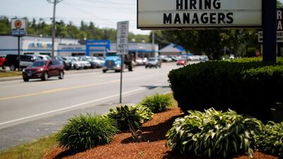 A sign on a Taco Bell restaurant advertises 'Now Hiring Managers' in Fitchburg, Massachusetts. But what to do when a new recruit proves less than ideal? Brian Snyder/Reuters