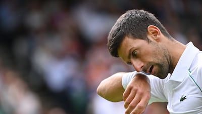 Djokovic wipes his face as he competes against Australia's Thanasi Kokkinakis. AFP