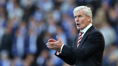 Mark Hughes was content as his Stoke City side came from behind twice to earn a point against Leicester City. Matthew Lewis / Getty Images
