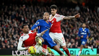 Chelsea's Joao Pedro attempts a shot under pressure from Gabriel and Piero Hincapie of Arsenal. Getty Images