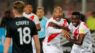 Peru's Christian Ramos, right, celebrates after scoring his side's second goal against New Zealand, with his teammate Alberto Rodriguez. Karel Navarro / AP Photo