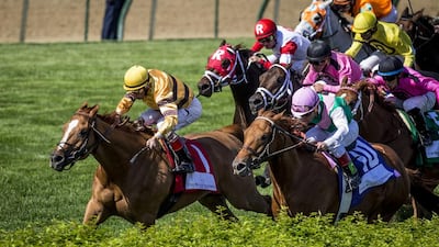 File photo of Wise Dan, in front, with John Valezquez. Alex Evers / AP Photo