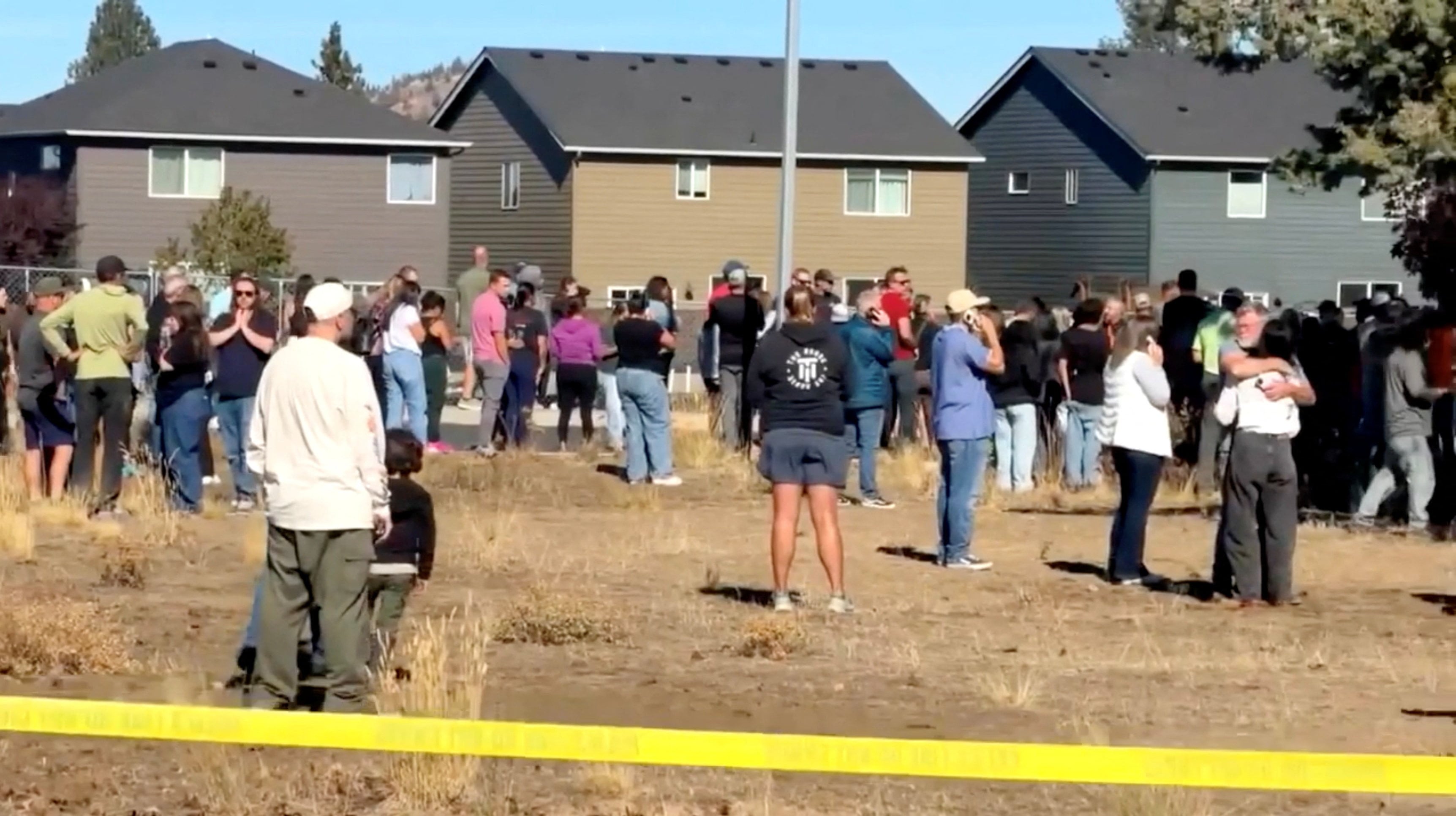 Residents gather outside Silver Rail Elementary School after the shooting. Reuters