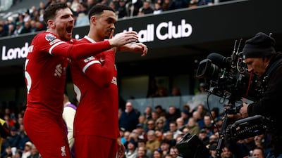 Liverpool's Trent Alexander-Arnold celebrates scoring the opening goal with Andrew Robertson. AFP