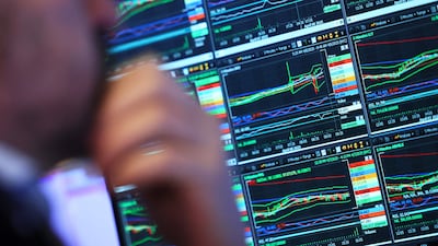Traders on the floor of the New York Stock Exchange during early trading on April 8 in New York City. AFP